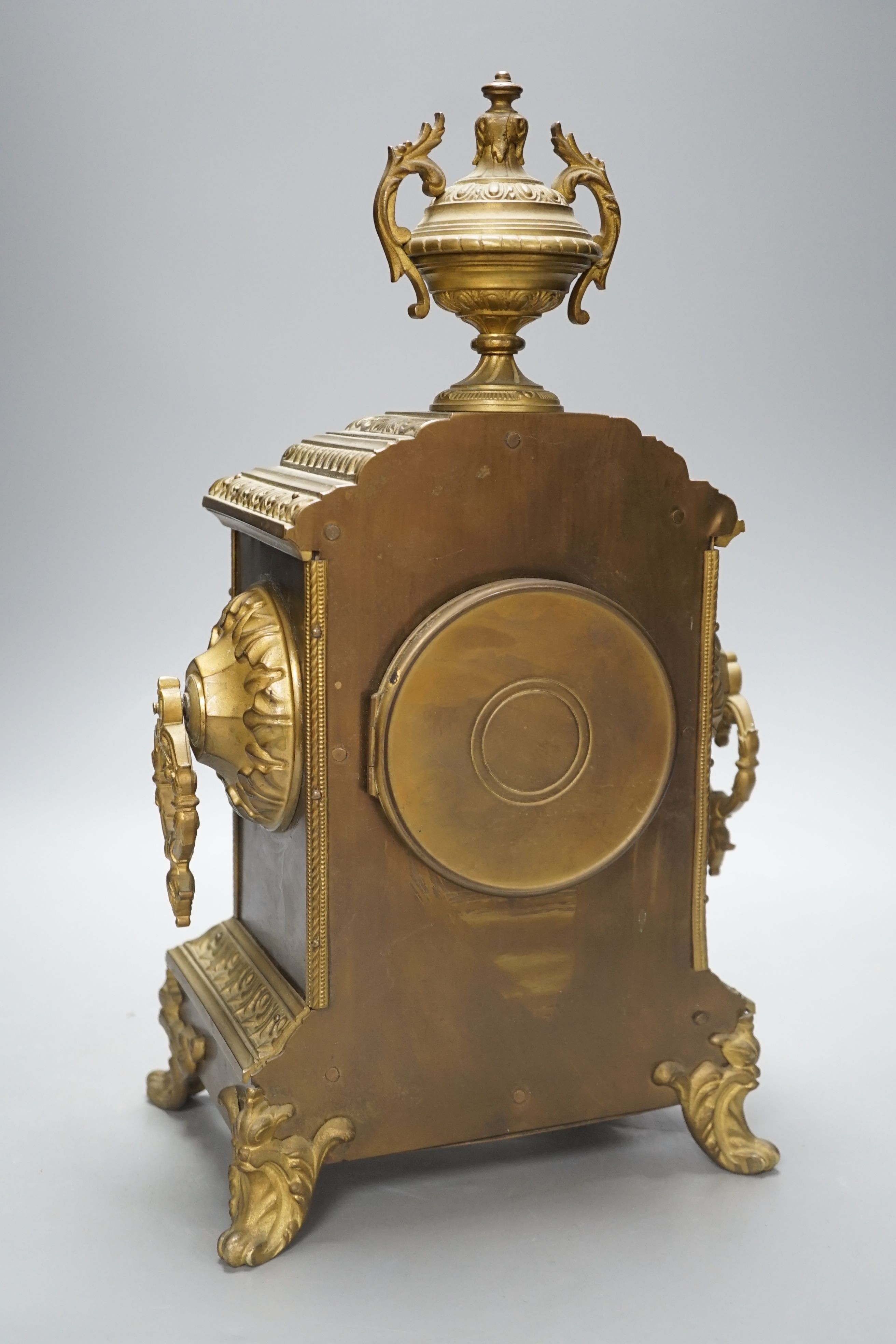 An early 20th century brass mantel clock, 40 cms high.